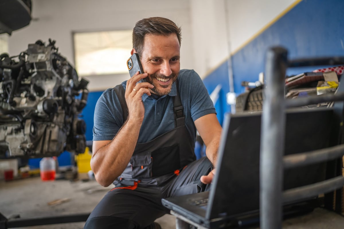 Automotive technician using modern technology for repairs