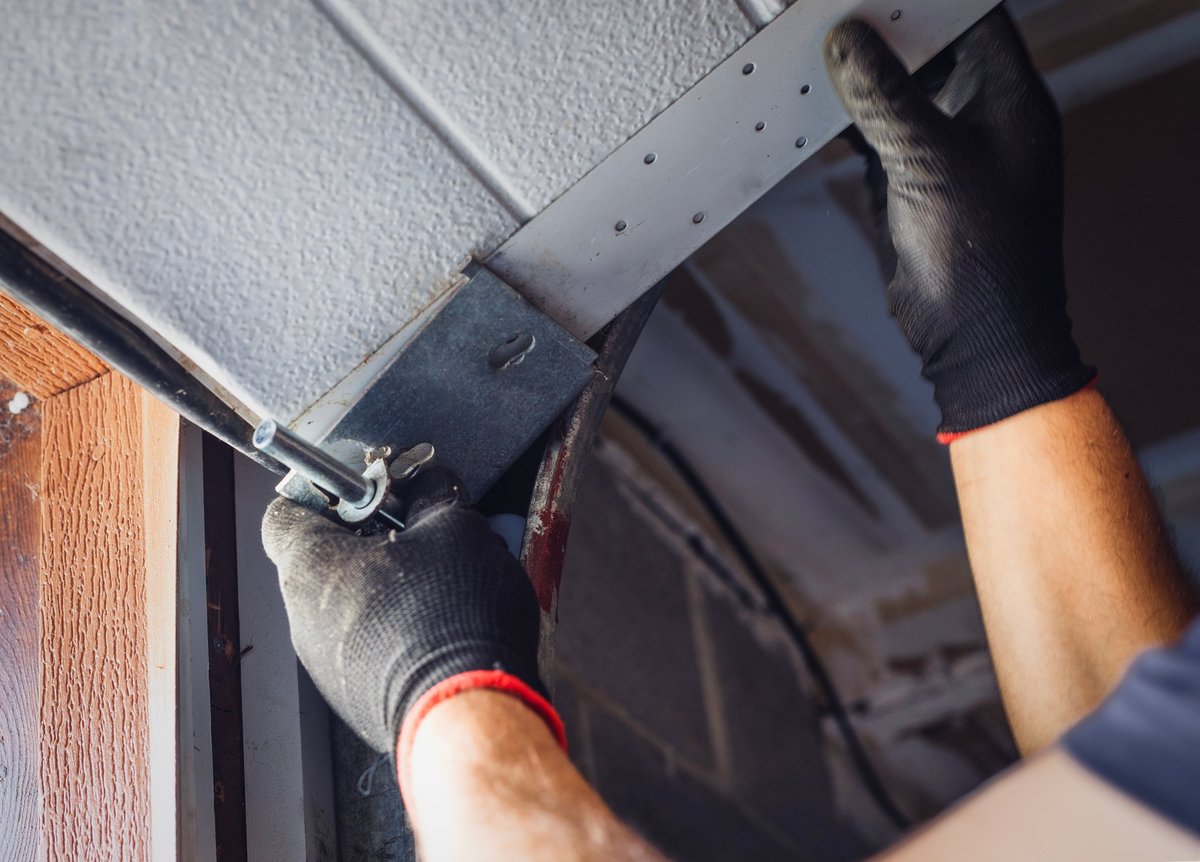 Mechanic performing precise installation work